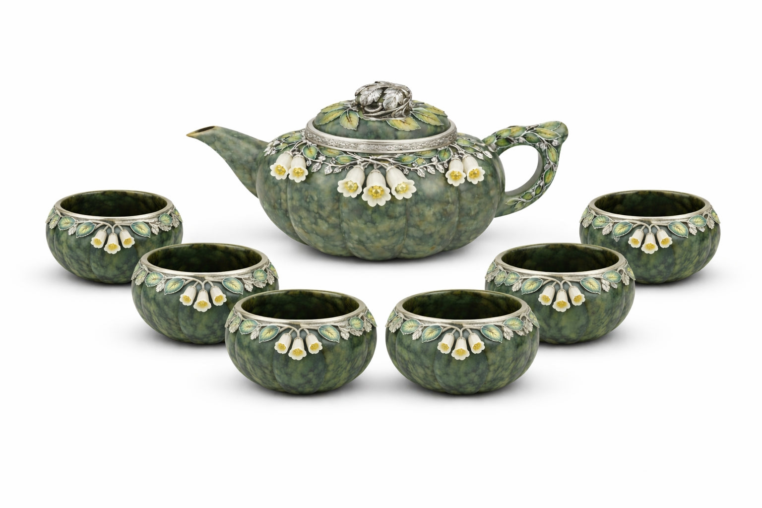 Luxury nephrite jade tea set including teapot and six cups, featuring hand carved white jade flowers, yellow sapphire centers, and detailed silver enamel foliage
