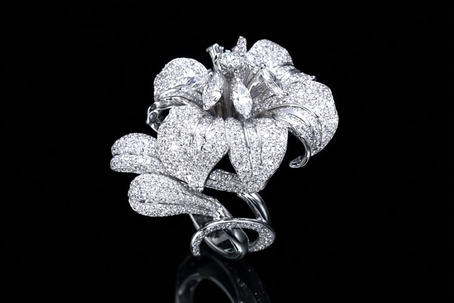 Diamond floral cocktail ring in 18K white gold with pavé-set petals and marquise diamond center, high jewelry flower design