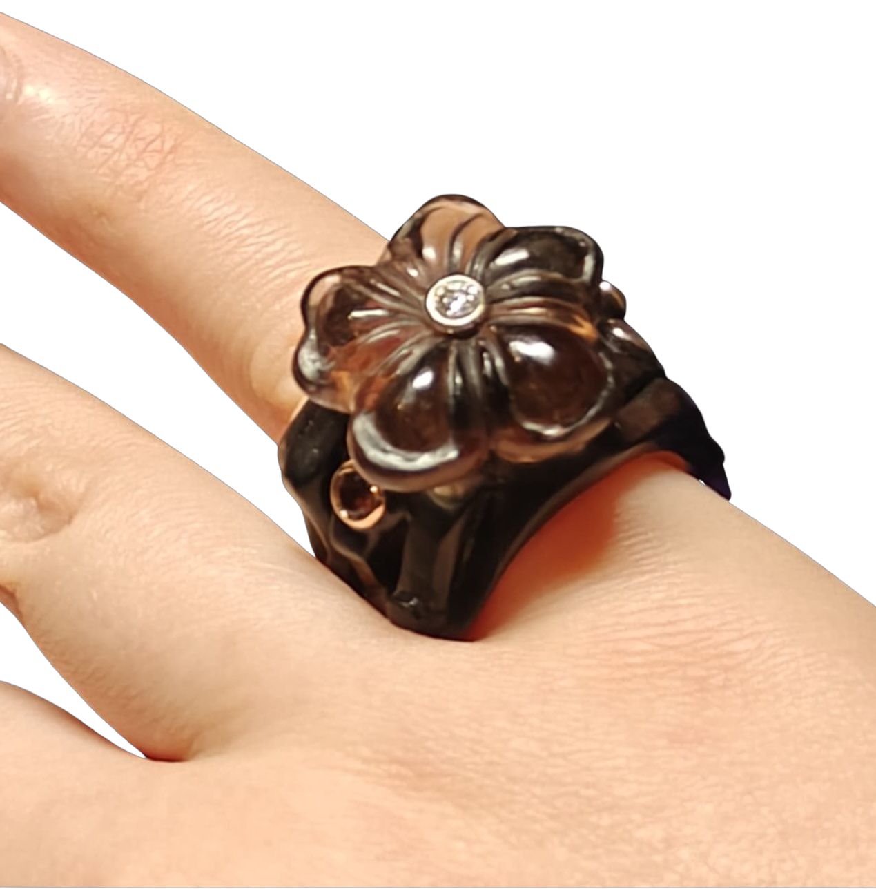 Side view of the Midnight Blossom ring on hand, showcasing the carved smoky quartz flower, ebony wood outer ring, 14K pink gold inner band, and gemstone accents including tourmalines and a 0.17 ct diamond from the Stone Garden Collection.