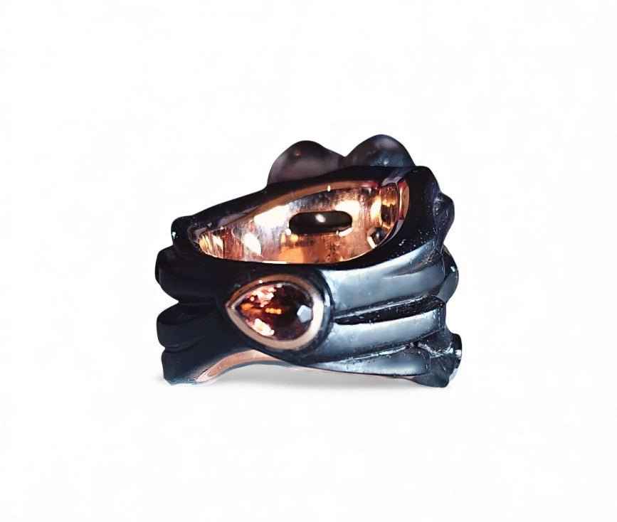 Front view of the Midnight Blossom ring from the Stone Garden Collection, featuring a hand-carved 28ct smoky quartz flower set in 14K pink gold with a black ebony wood base, accented by 0.85ct tourmalines and a 0.17ct diamond center.