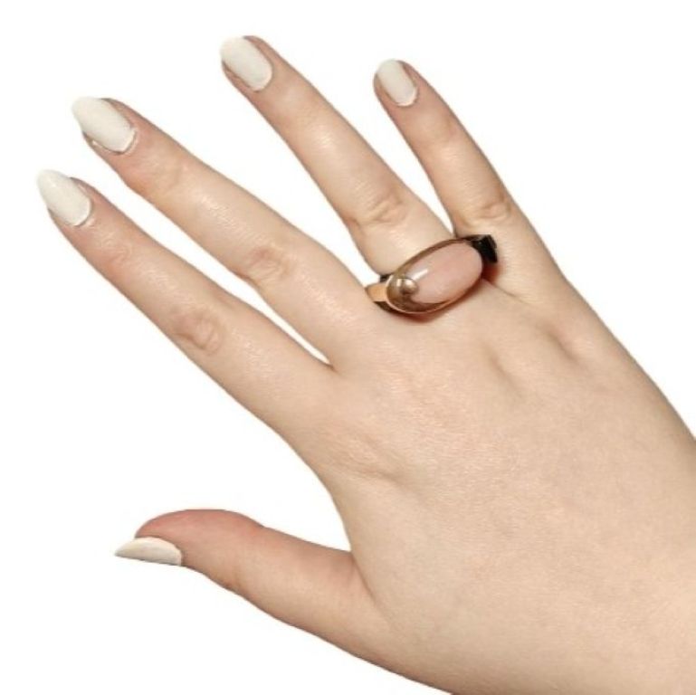 Modern Muse pink opal statement ring worn on hand showing 14K pink gold setting and ebony wood sculptural band by Konforti Jewelry