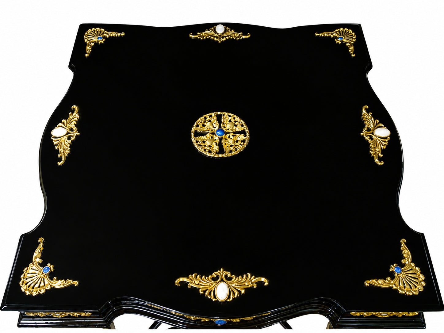 Top view of a handcrafted Napoleon Empire chess table with black lacquer surface, vermeil decorative motifs, mother of pearl inlays and central ornamental medallion.