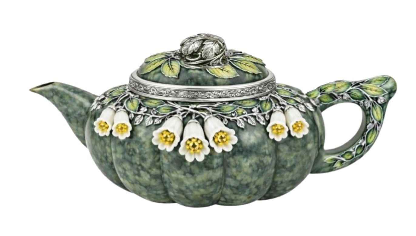 Handcrafted nephrite jade teapot with sculpted silver branches, white jade bluebell flowers, and yellow sapphire accents with green enamel detailing