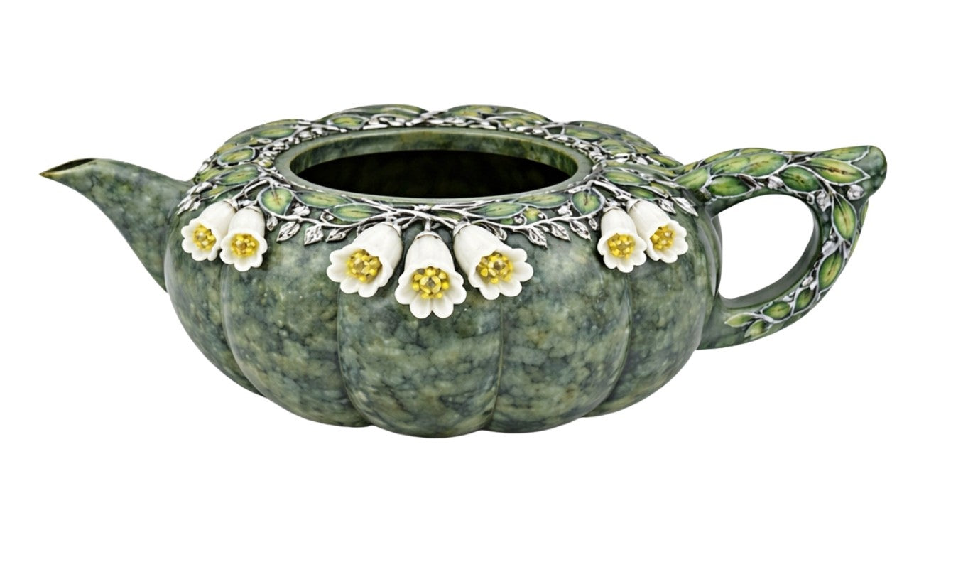 Top view of nephrite jade teapot showing interior stone texture and detailed silver and enamel bluebell decoration around the rim