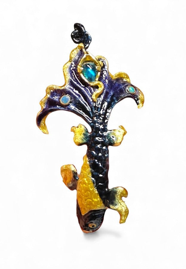 Front view of the Ocean Duet pendant from the Stone Garden Collection, featuring a handcrafted 960 silver design set with 3ct blue topaz and 0.01ct opal gemstones, detailed with Limoges-style hot enamel that evokes ocean waves.