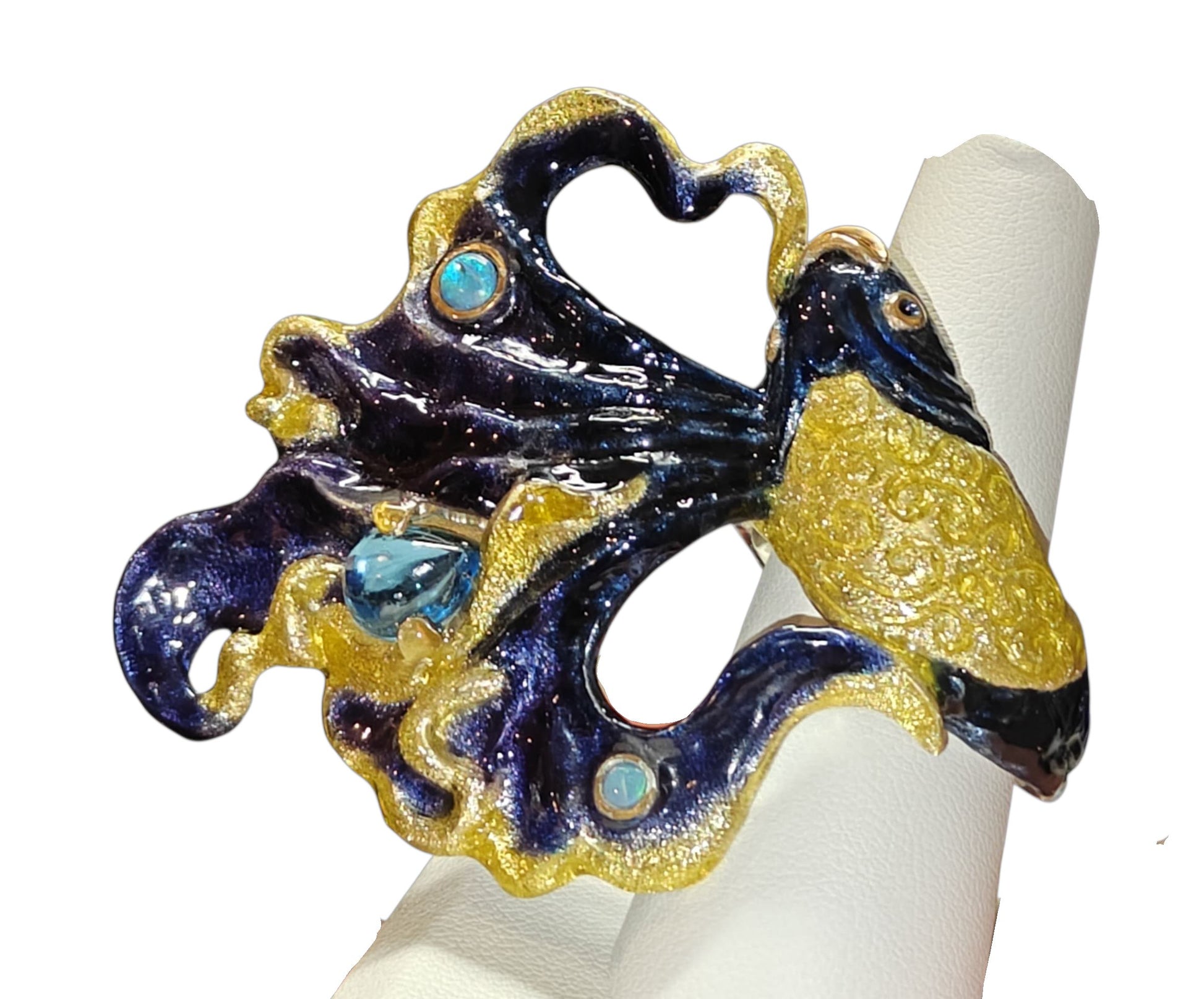 Ocean Duet ring by Konforti Jewelry, handcrafted in 960 silver with a 3 ct blue topaz, 0.01 ct opal, and Limoges hot enamel wave detailing inspired by the sea.Ocean Duet ring by Konforti Jewelry, handcrafted in 960 silver with a 3 ct blue topaz, 0.01 ct opal, and Limoges hot enamel wave detailing inspired by the sea.