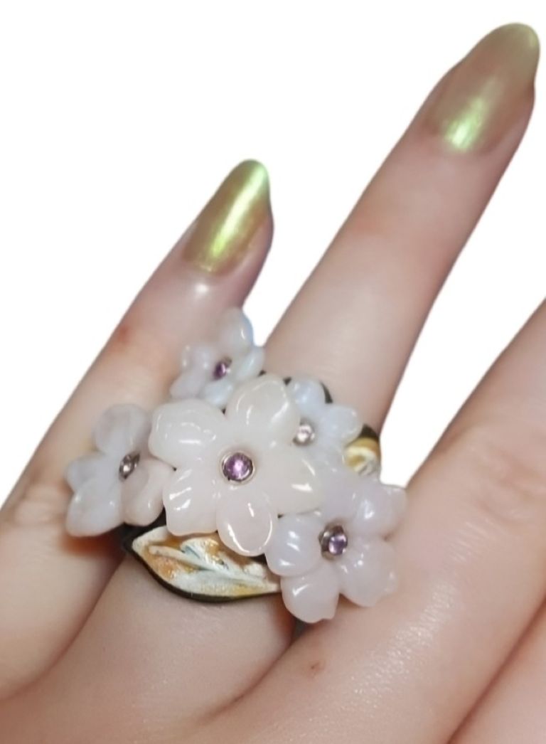 Pink Sakura pink opal flower ring worn on hand with pink sapphire centers gold and ebony band luxury artisan jewelry by Konforti