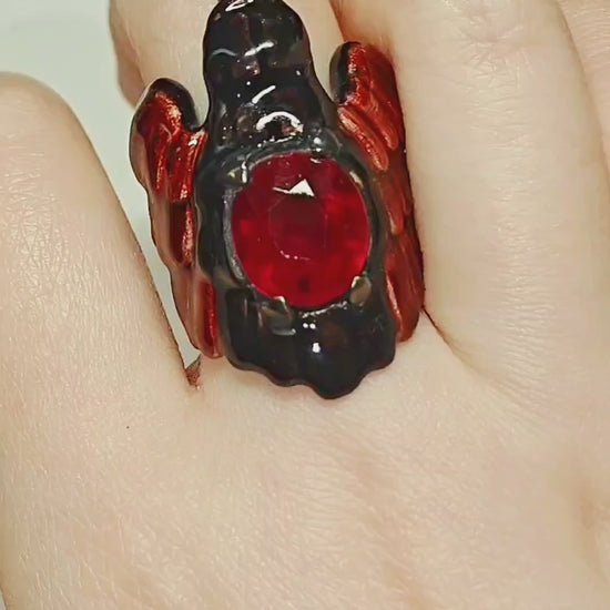 Video showcasing the Royal Raven ring by Konforti Jewelry, crafted in 960 silver with an 8.45 ct treated ruby, detailed Limoges hot-enamel artwork, and 24K gold-plated accents.