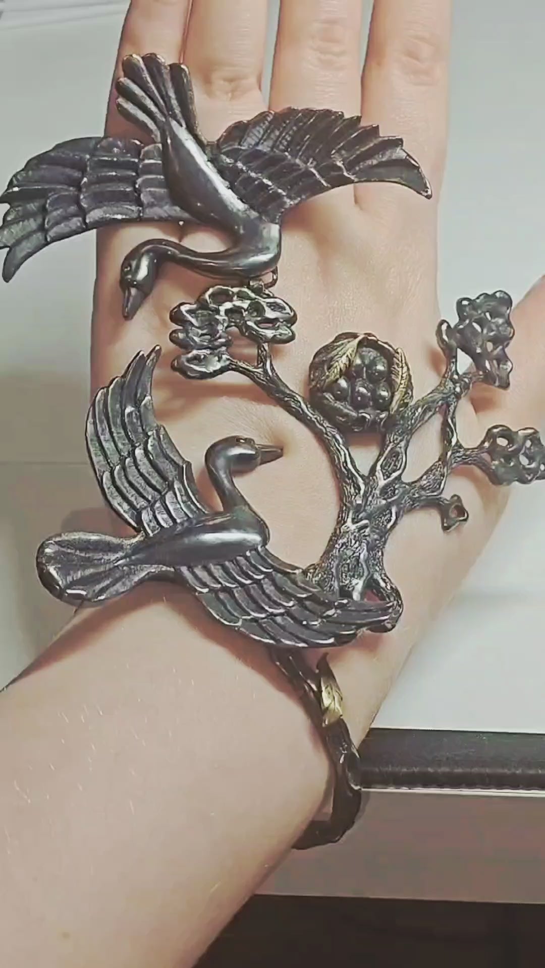 Video showcasing the Song of the Nest ring and bracelet set by Konforti Jewelry, handcrafted in 960 silver with 24K gold plating and artistic tarnishing. The camera highlights the organic nest-inspired textures and the detailed craftsmanship of the Stone Garden Collection.