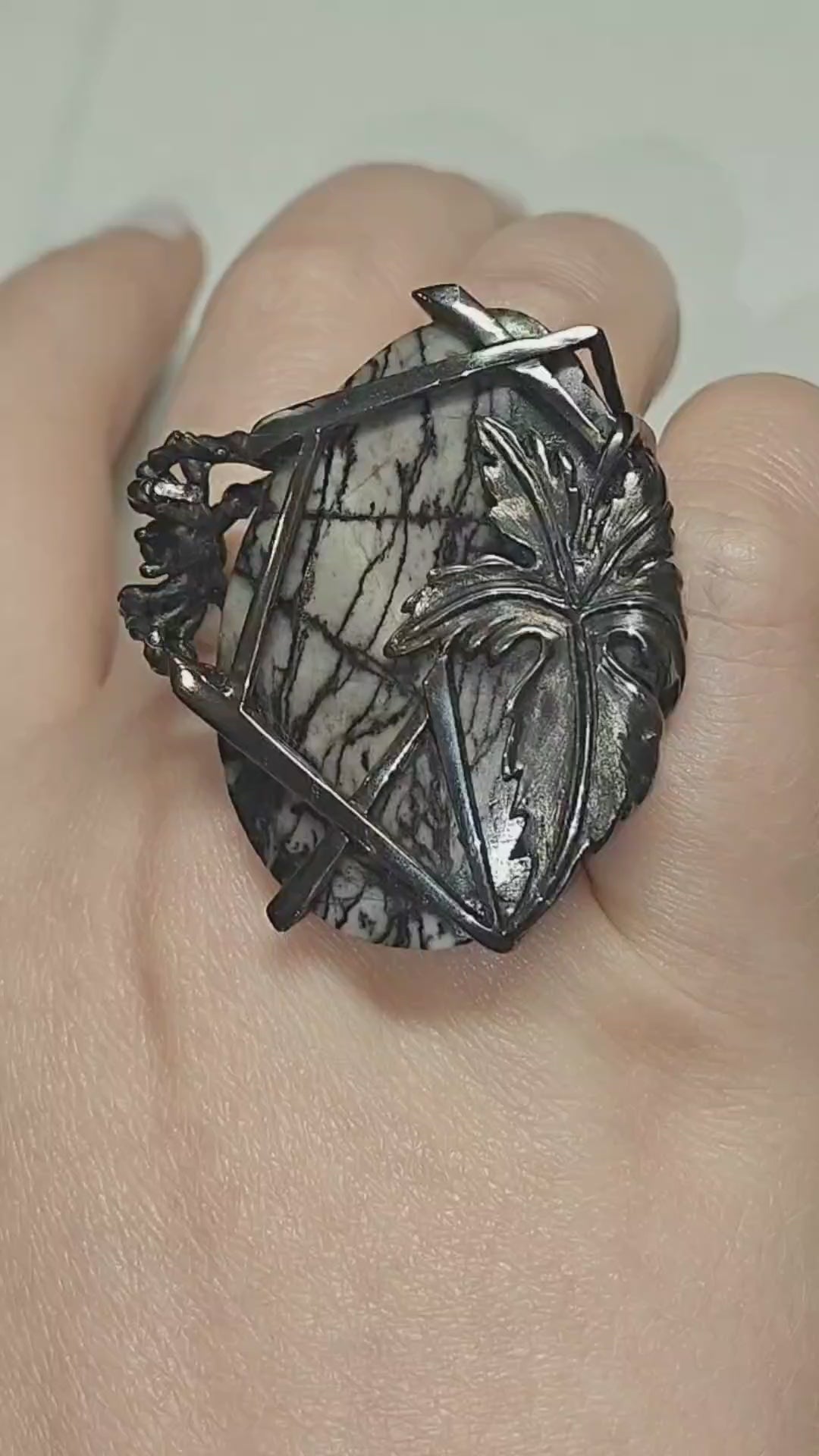 Video of the Weaver of Dreams ring by Konforti Jewelry, handcrafted in 925 silver and centered with a 51.3 ct landscape jasper enhanced by artistic silver tarnishing. The video highlights the stone’s natural scenery patterns and the detailed craftsmanship of the Stone Garden Collection.