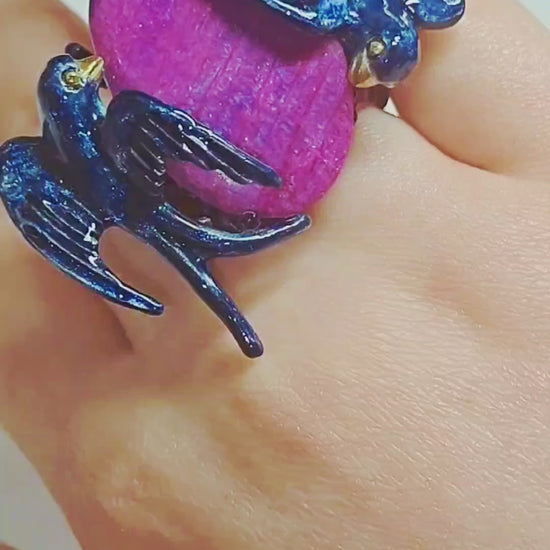 Video showcasing the Celestial Flight ring by Konforti Jewelry, featuring a hand-carved 33 ct purple moonstone set in handcrafted 960 silver with Limoges hot enamel and 24K gold-plated accents.