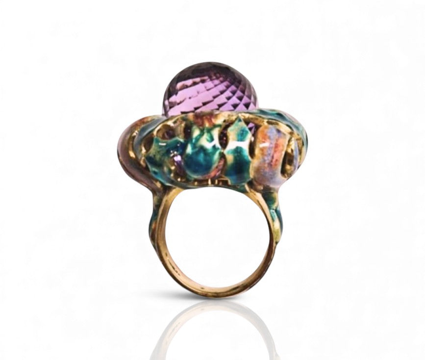 Front view of the Purple Thistle ring from the Stone Garden Collection, showcasing the 27.8ct amethyst briolette, hand-painted enamel colors, and white sapphire accents set in 18K yellow gold.