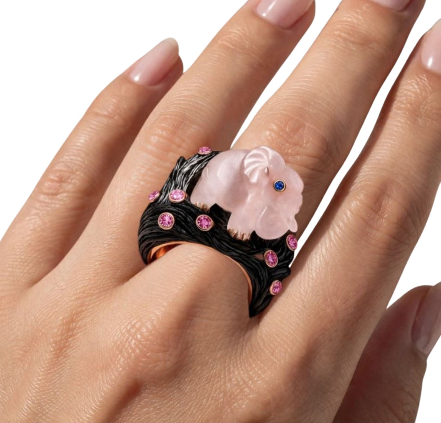 Rose quartz elephant cocktail ring worn on hand with pink sapphire accents, ebony wood band and rose gold inner ring