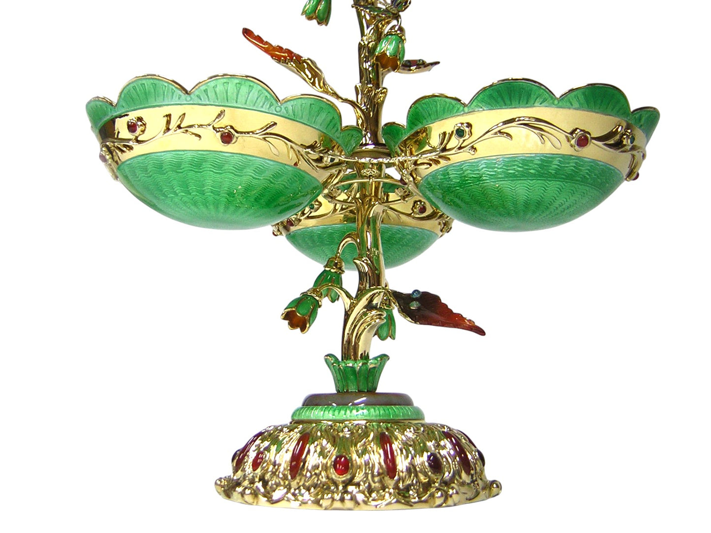 Detailed view of gold openwork lattice set with emeralds surrounding carved agate vase in Royal Bouquet centerpiece