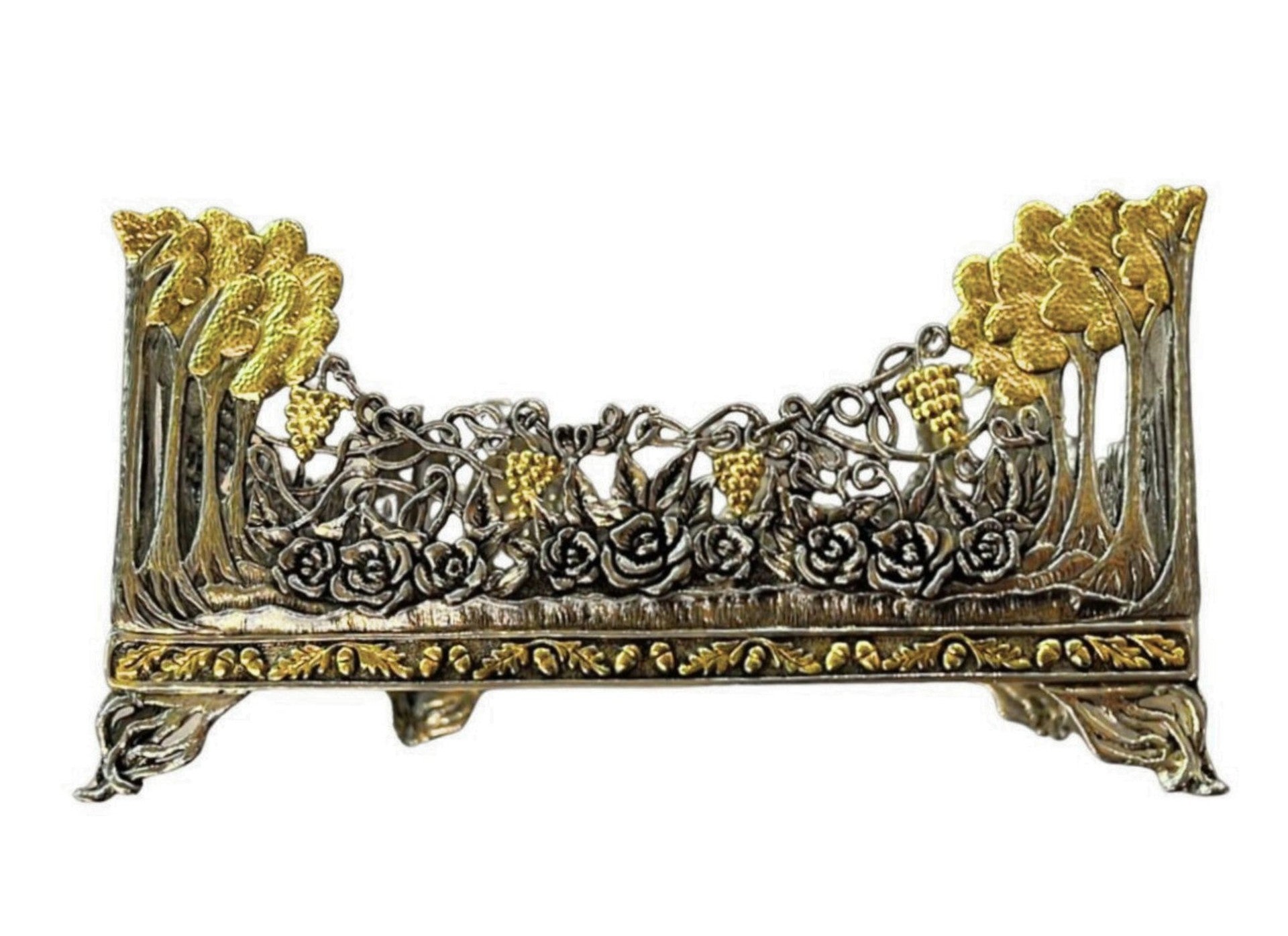 Side view of Royal Garden botanical napkin holder in tarnished sterling silver with 18K gold gilded flowers, roses, and grapevine ornamentation.