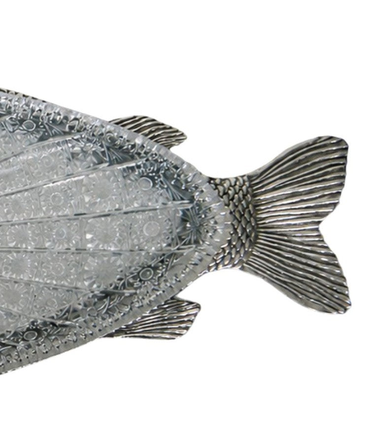 Sculpted silver carp fish tail with flowing lines and engraved texture, artisanal metalwork detail