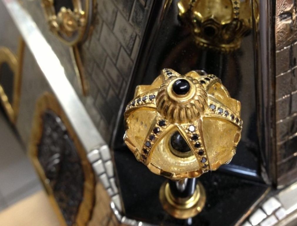 Detail view of the crowned corner element on the “Napoleon I and the Campaign of 1812 vs. Alexander I” monumental sculptural silver chess set, featuring architectural crown motifs with hot enamel accents in a Fabergé-style decorative tradition.