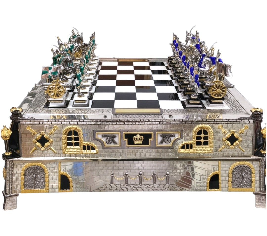 Full front view of the “Napoleon I and the Campaign of 1812 vs. Alexander I” monumental sculptural silver chess set, featuring a fortified architectural board with onyx inlays, hot enamel details, and Fabergé-style craftsmanship.