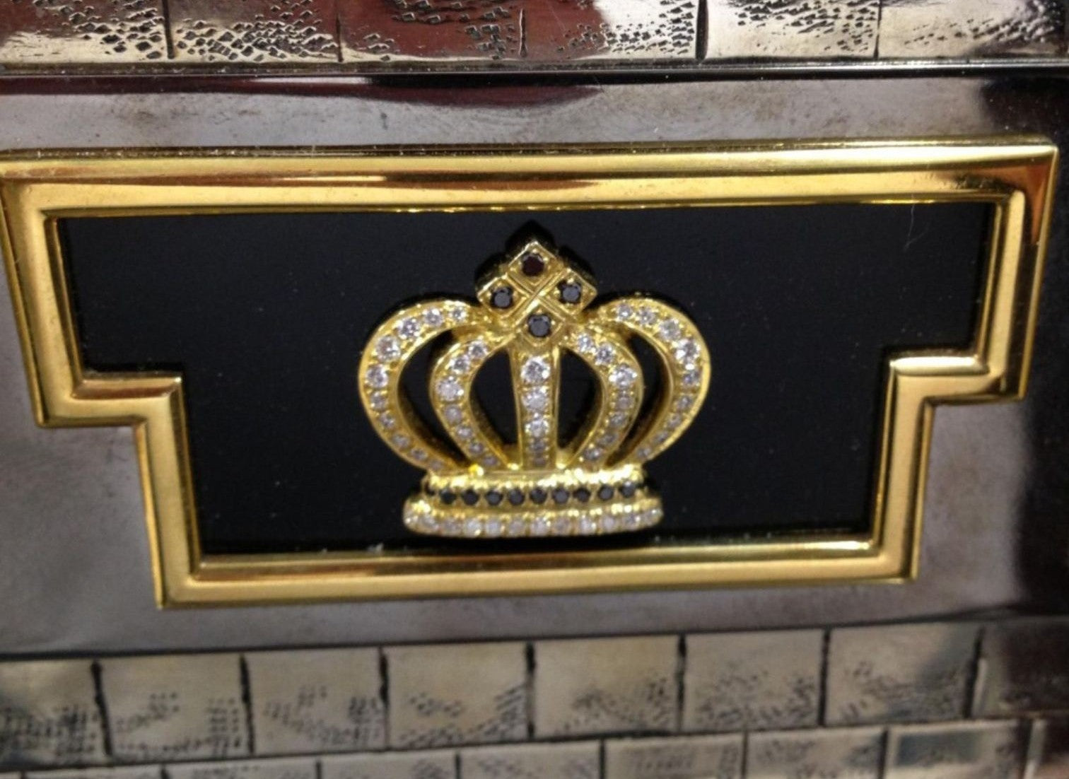 Detail view of the side ornamentation on the “Napoleon I and the Campaign of 1812 vs. Alexander I” monumental sculptural silver chess set, highlighting architectural relief work, hot enamel accents, and Fabergé-style decorative craftsmanship.