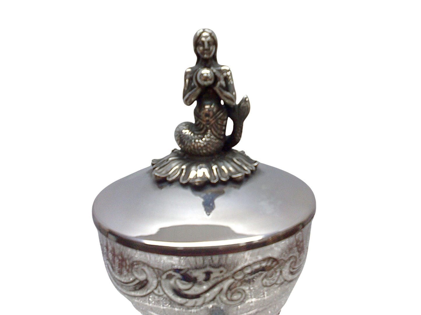 Close-up detail of the silver mermaid finial on the lid of the “Enchantress of the Sea” sculptural caviar server, highlighting hand-modeled figurative craftsmanship and refined surface detailing.
