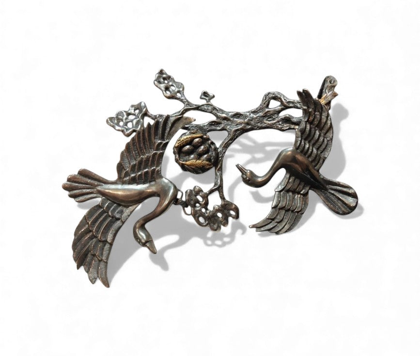 Front view of the Song of the Nest Set from the Stone Garden Collection, showcasing the handcrafted 960 silver ring and bracelet with 24K gold-plated accents and artistic tarnishing that evokes the warmth and texture of a natural nest.