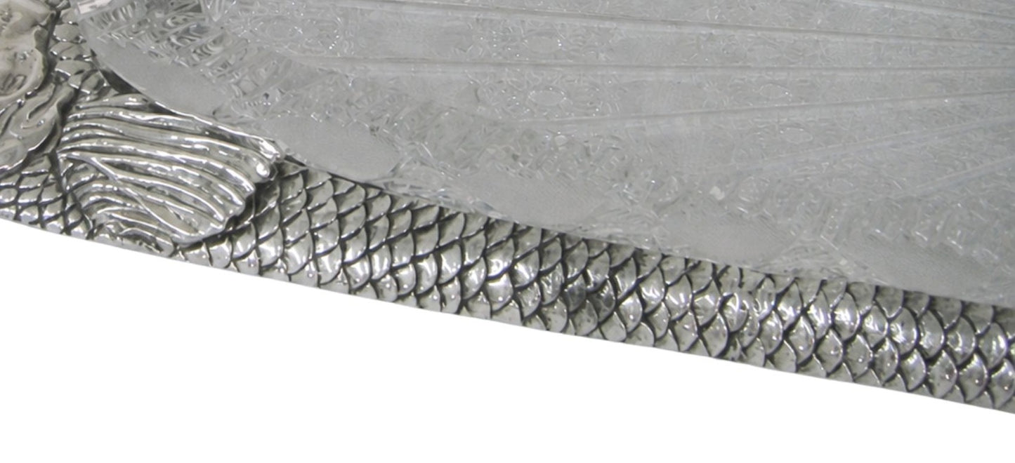 Hand engraved sterling silver fish scales with textured surface, showcasing fine craftsmanship and reflective finish