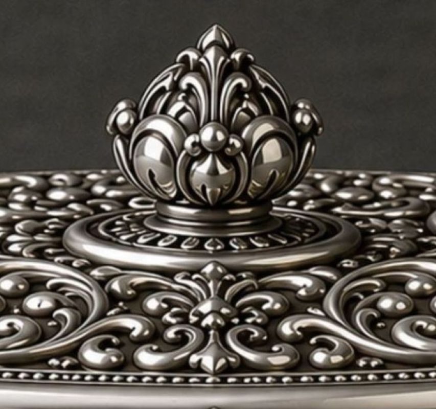 Ornate sterling silver lid finial with hand-finished floral scrollwork on Passover matzah holder