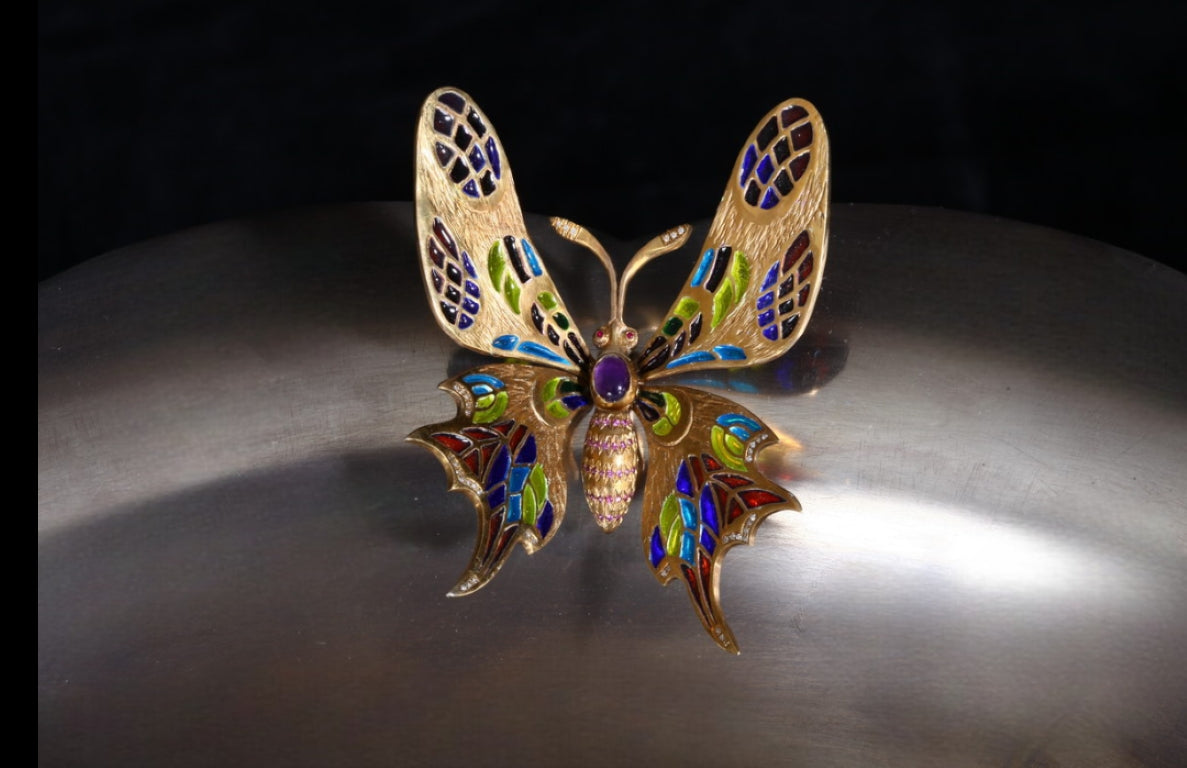 Close-up of a butterfly detail in the “Summer Pond” centerpiece featuring plique-a-jour enamel wings, fine gemstone settings, and delicate handcrafted metalwork.