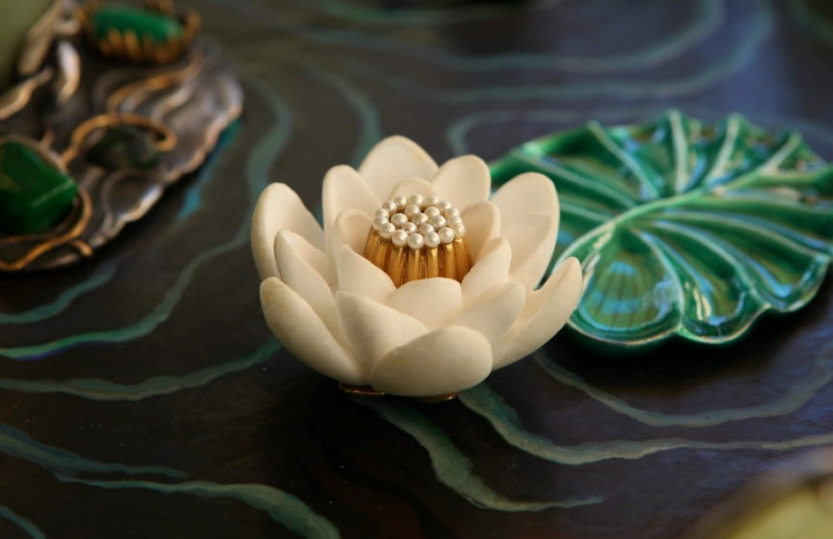 Detail of a hand-carved lily flower and lily pad in the “Summer Pond” sculptural centerpiece, crafted from natural gemstones and solid silver with refined organic engraving.