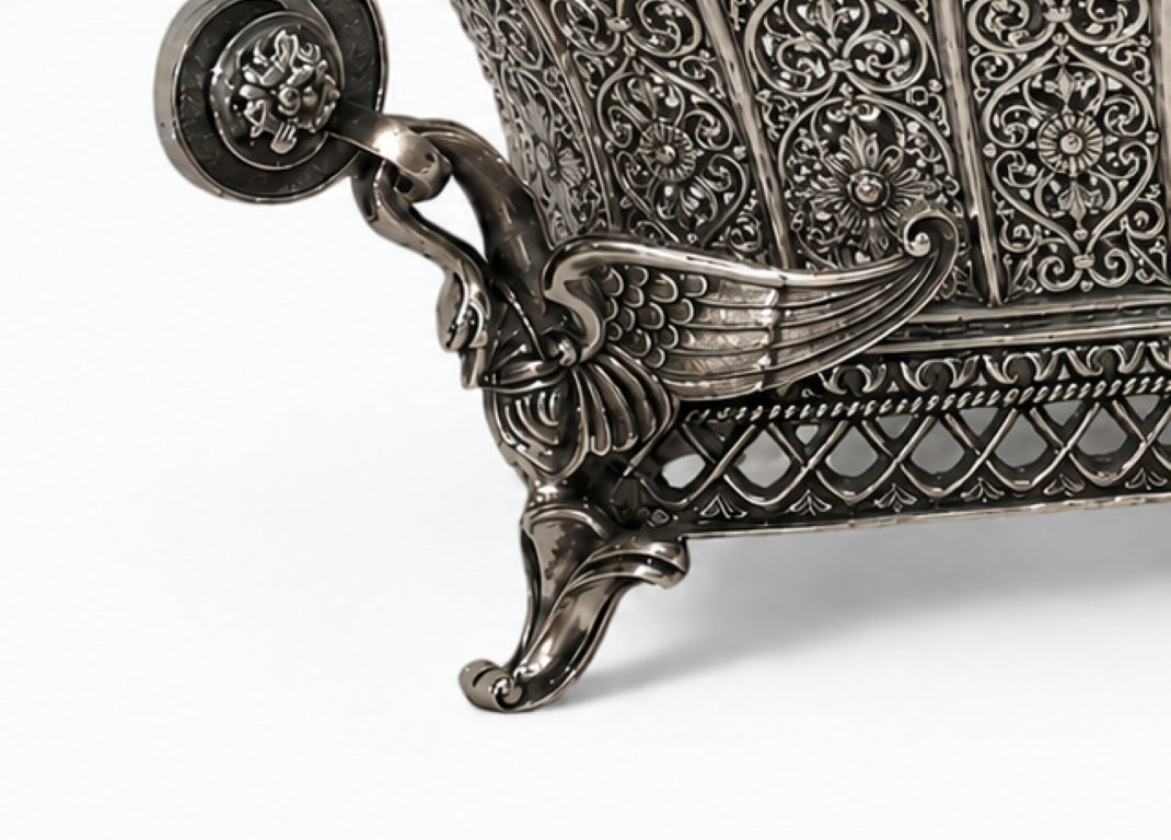 Detailed view of sculpted swan ornament and decorative foot on Swan Fidelity sterling silver centerpiece vase, showcasing exceptional relief work and oxidized silver craftsmanship.