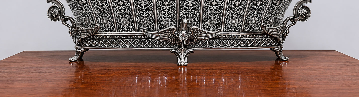 Intricate pierced sterling silver ornamentation with floral arabesques, rosettes, and scrolling foliage on the Swan Fidelity Imperial centerpiece vase.