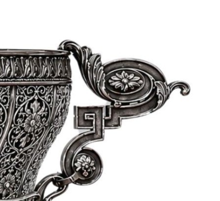 Close-up of handcrafted sterling silver handle with neoclassical scrollwork, floral medallions, and Imperial decorative motifs on the Swan Fidelity centerpiece vase.
