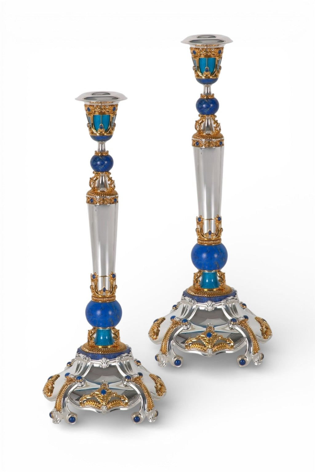Matching imperial silver candlesticks with 24k gold accents, lapis lazuli spheres and turquoise guilloché enamel decoration.