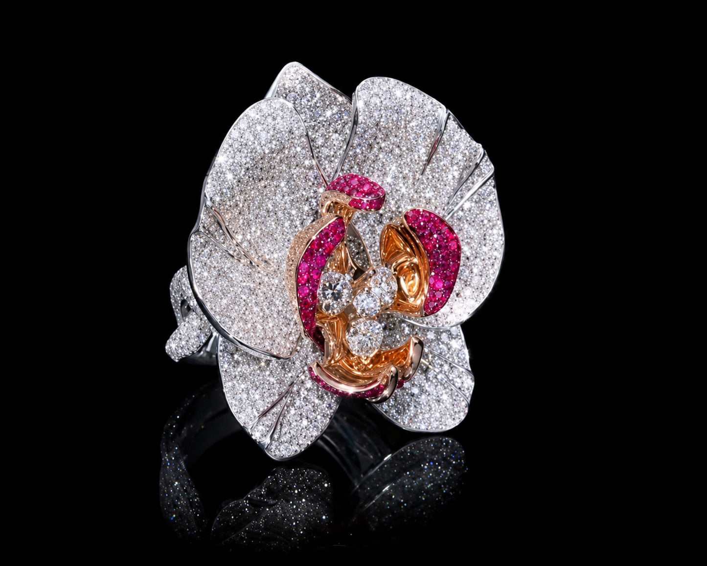 Handcrafted Empress Orchid cocktail ring in 18K white gold with white rhodium, featuring pavé-set diamonds across sculptural orchid petals, vivid ruby-set inner petals in pink gold, and four round brilliant center diamonds.