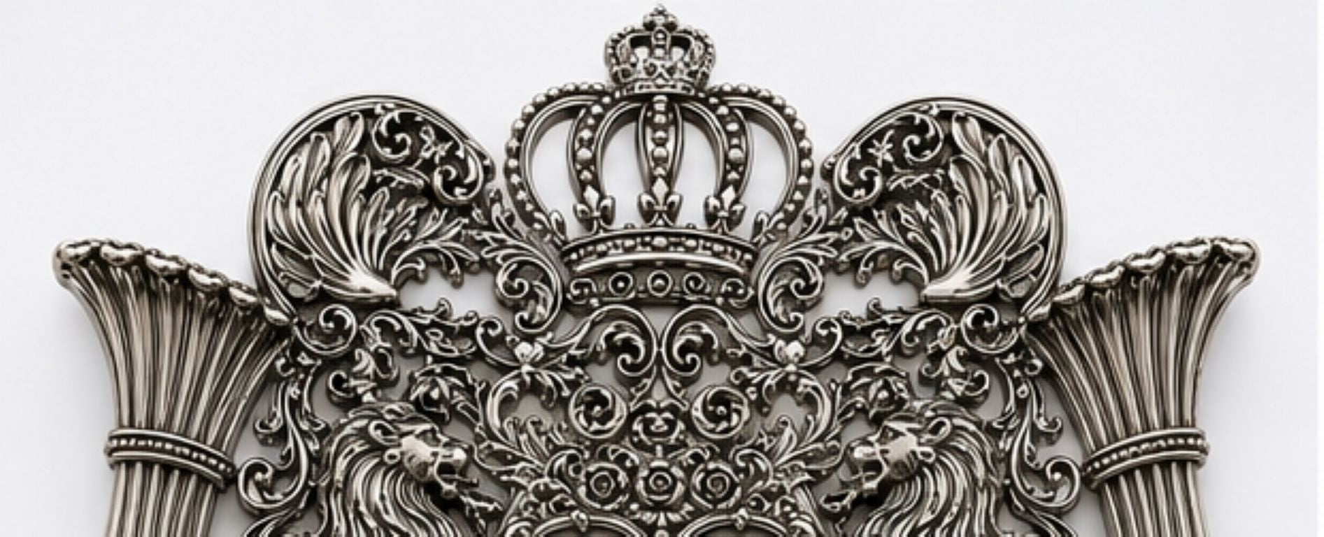 Detail of raised Hebrew Ten Commandments tablets framed by heraldic lions and elaborate sterling silver scrollwork on the Royal Guardian Lions Torah shield.