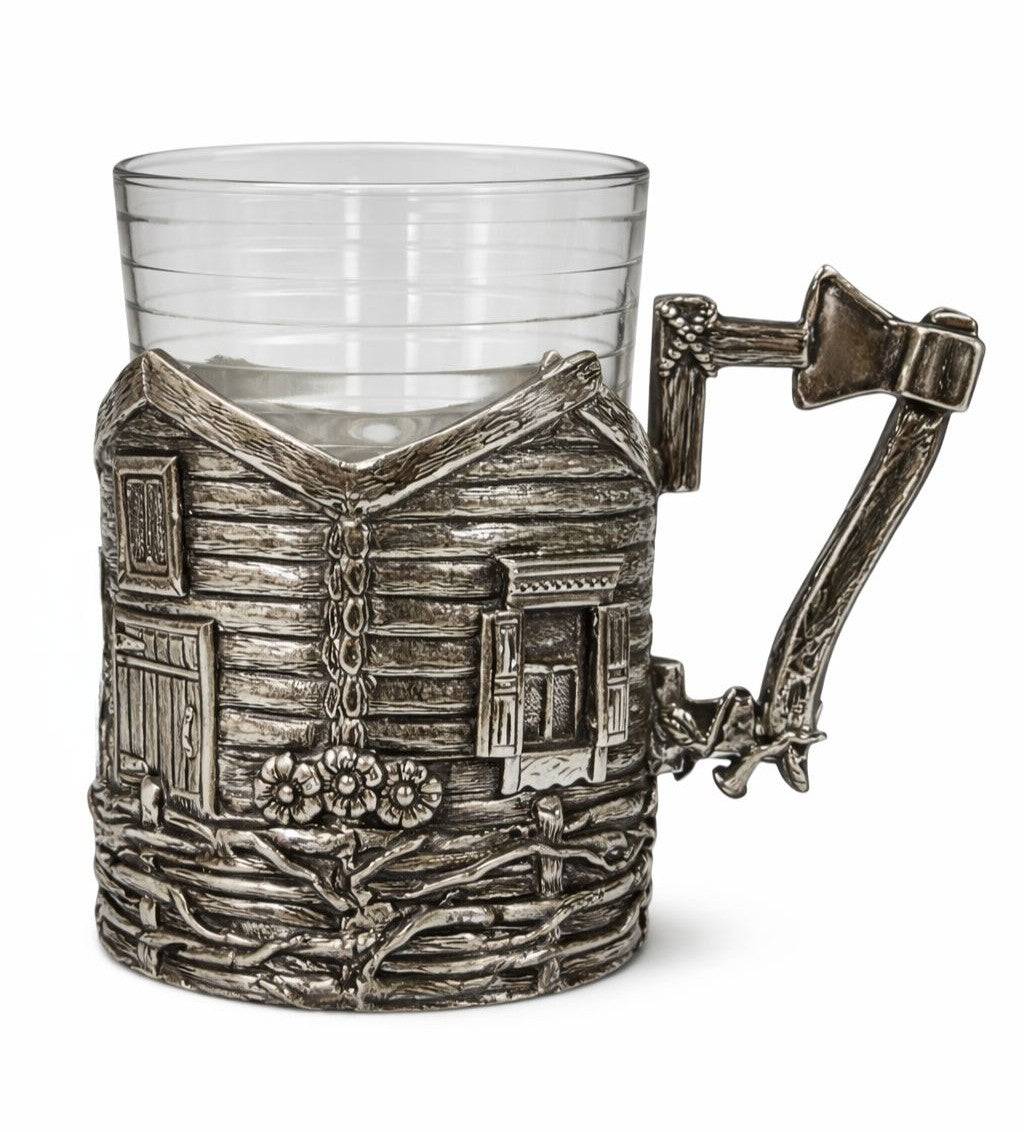 Sterling silver cup holder by Konforti Jewelry featuring a sculptural village house relief, rustic fence, floral details, and handcrafted branch-style handle